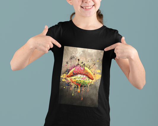 Add a splash of urban flair to your kids wardrobe with our unisex graffiti lips t-shirt, where bold design meets unbeatable comfort. Available in a range of sizes, this tee is a must-have for urban fashionistas and art lovers alike. Step into the world of street art with confidence and make a colourful statement wherever they go. 