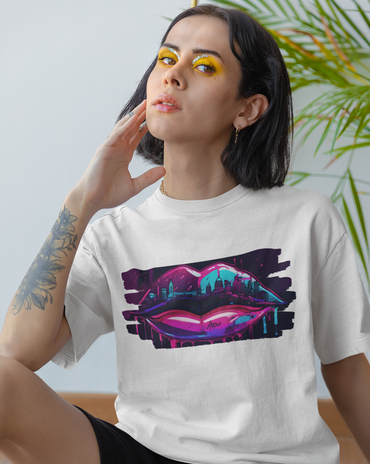 Add a splash of urban flair to your wardrobe with our women's graffiti lips t-shirt, where bold design meets unbeatable comfort. Available in a range of sizes, this tee is a must-have for urban fashionistas and art lovers alike. Step into the world of street art with confidence and make a colourful statement wherever you go. Featuring a dynamic graffiti-inspired design of luscious lips, this tee is a standout piece for those who love to make a statement.