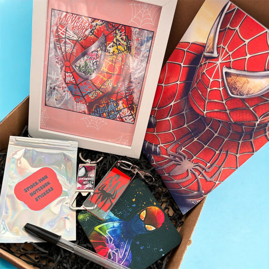 Hand-Made Spider-Man Gift Set - Exclusive 5x7 Foil Print, Notebook, and More!  Our Spider-Man Gift Set is a sensational collection celebrating everyone's favorite wall-crawler! Dive into the superhero universe with a framed 5x7 high-gloss foil print of The Amazing Spider-Man comic cover, accompanied by a range of themed accessories.