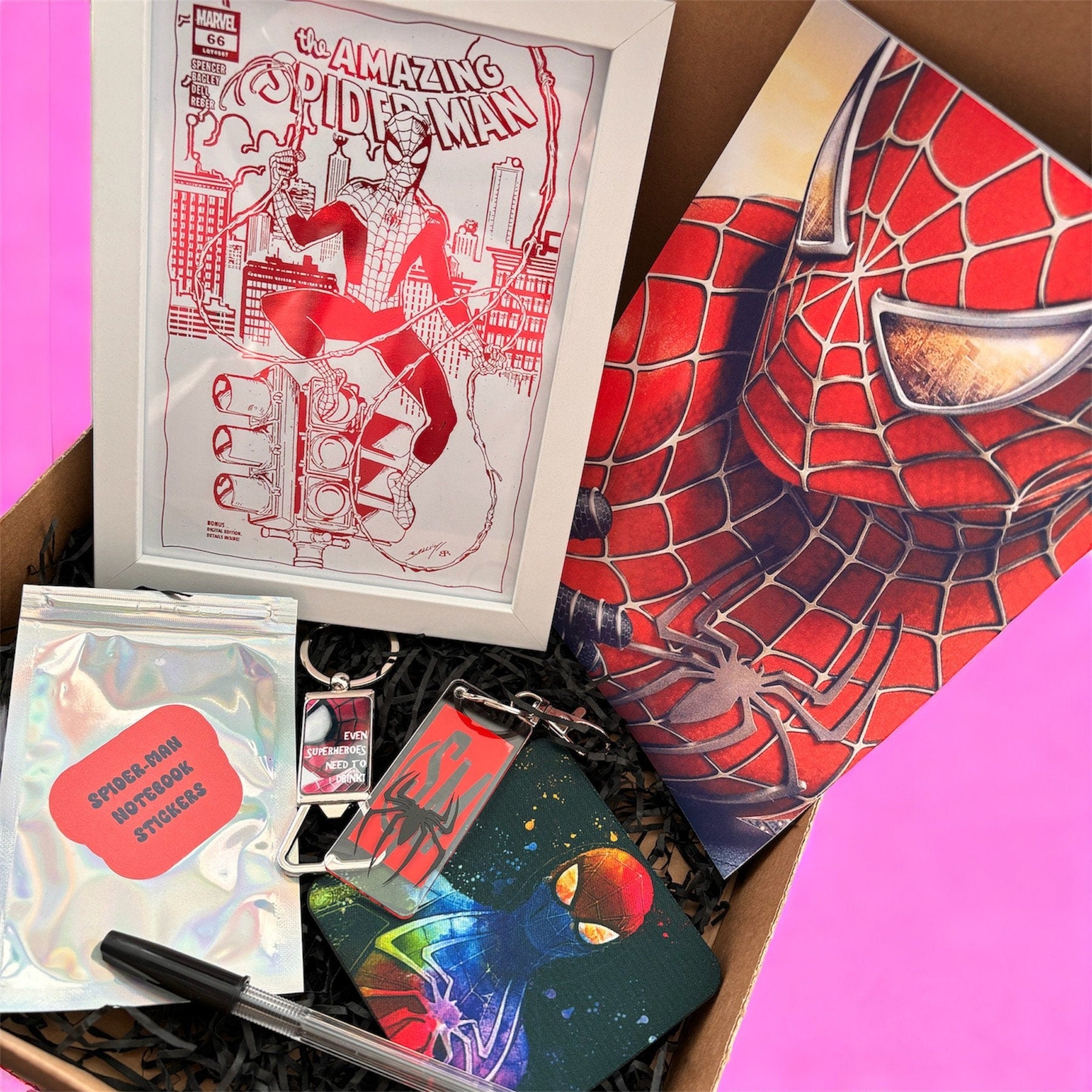 Hand-Made Spider-Man Gift Set - Exclusive 5x7 Foil Print, Notebook, and More!  Our Spider-Man Gift Set is a sensational collection celebrating everyone's favorite wall-crawler! Dive into the superhero universe with a framed 5x7 high-gloss foil print of The Amazing Spider-Man comic cover, accompanied by a range of themed accessories.