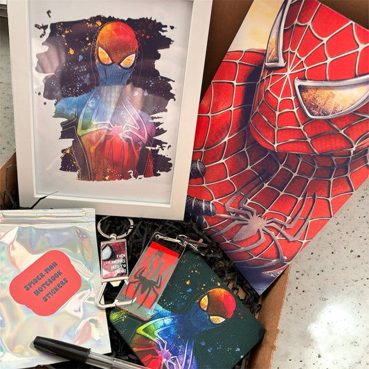 Hand-Made Spider-Man Gift Set - Exclusive 5x7 Foil Print, Notebook, and More!  Our Spider-Man Gift Set is a sensational collection celebrating everyone's favorite wall-crawler! Dive into the superhero universe with a framed 5x7 high-gloss foil print of The Amazing Spider-Man comic cover, accompanied by a range of themed accessories.