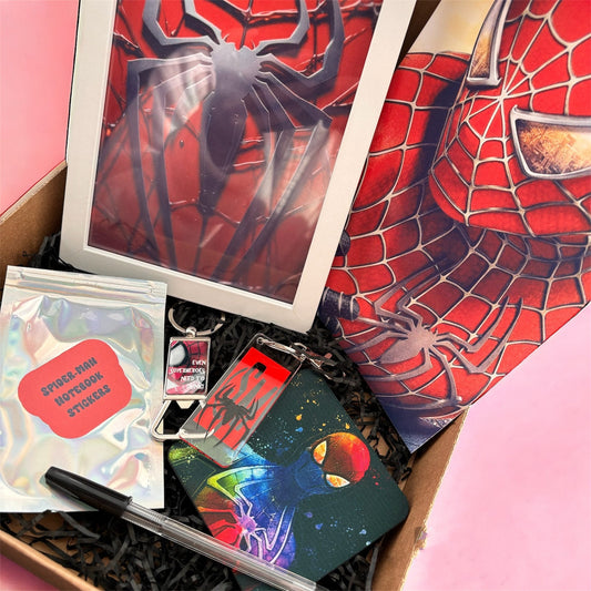 Hand-Made Spider-Man Gift Set - Exclusive 5x7 Foil Print, Notebook, and More!  Our Spider-Man Gift Set is a sensational collection celebrating everyone's favorite wall-crawler! Dive into the superhero universe with a framed 5x7 high-gloss foil print of The Amazing Spider-Man comic cover, accompanied by a range of themed accessories.